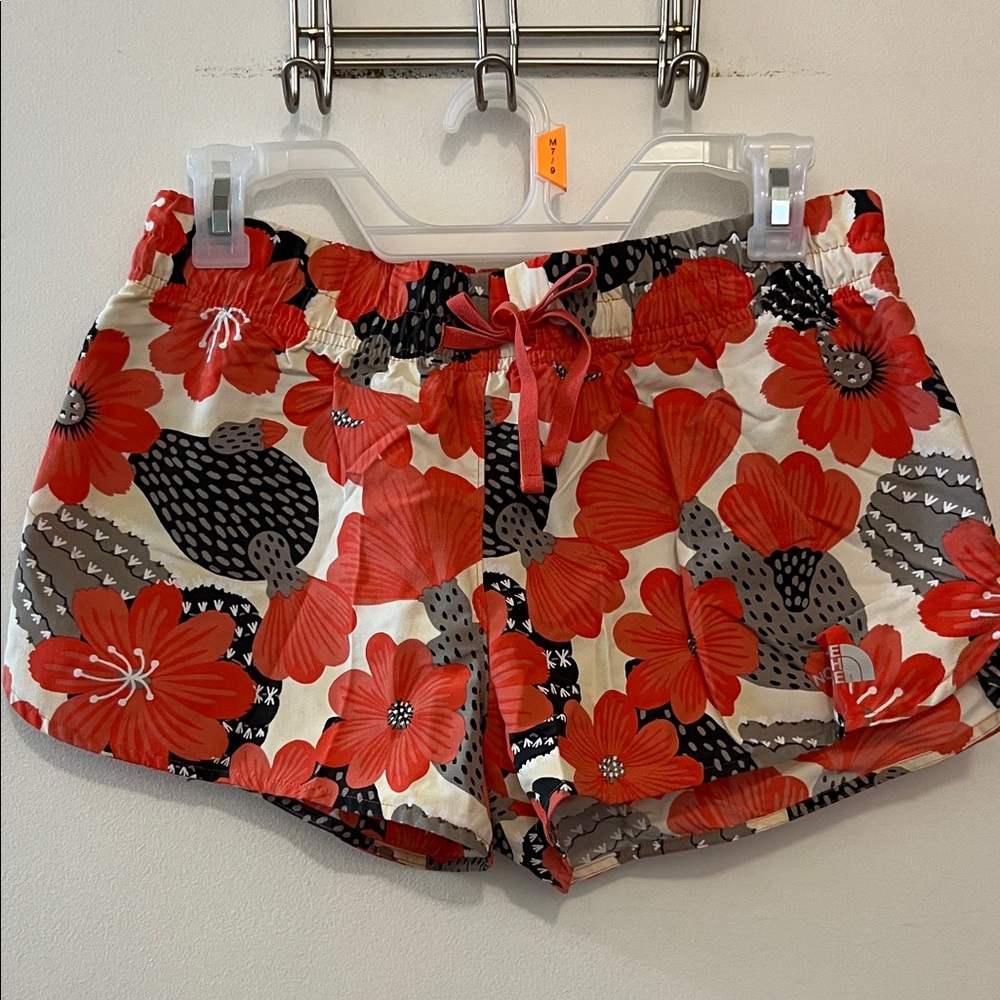 The North face red and black cactus flower quick dry shorts size small